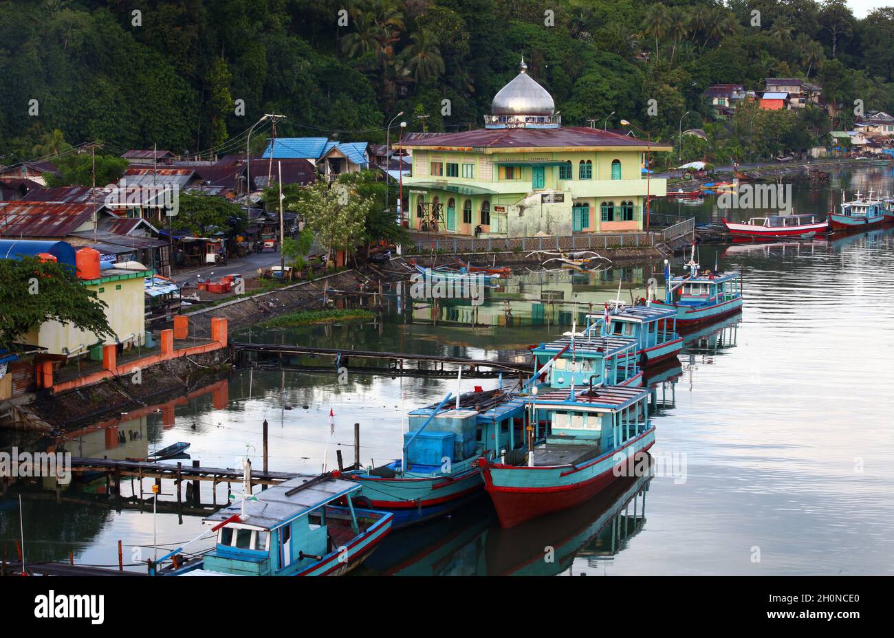 Muaro is a small old port on the Batang Arau river used by many small wooden fishing boats in the old town part of Padang, West Sumatra, Indonesia. Stock Photo