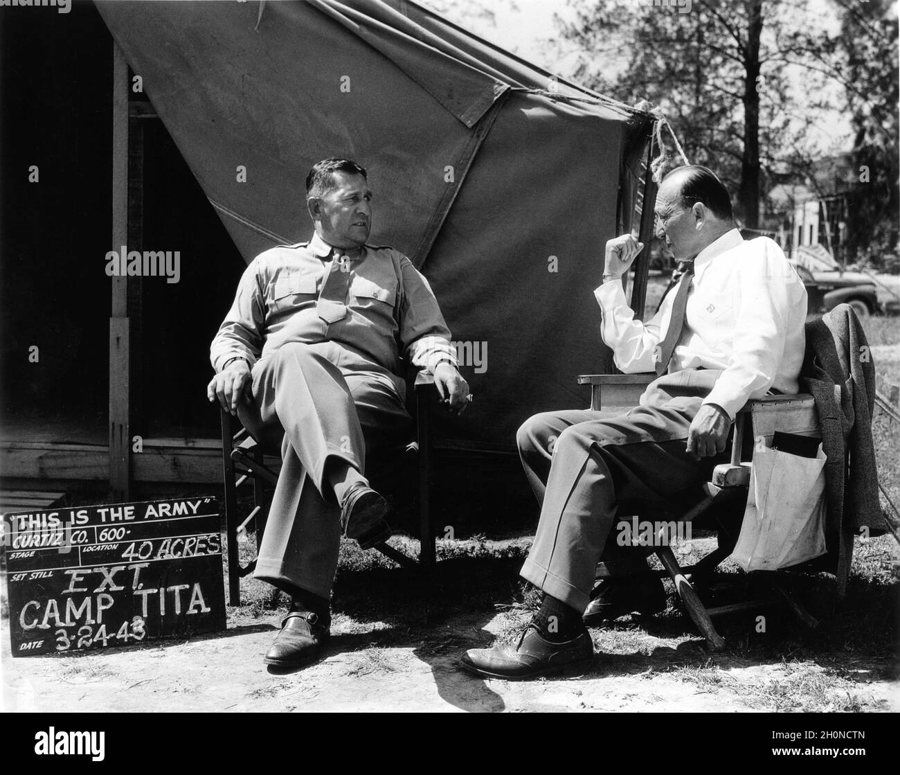 Major SIMON P. AMBRAZE commanding officer of the detachment of soldiers used in the film with Director MICHAEL CURTIZ on set location candid at Camp Tita during filming of THIS IS THE ARMY 1943 director MICHAEL CURTIZ play Irving Berlin Warner Bros. Stock Photo