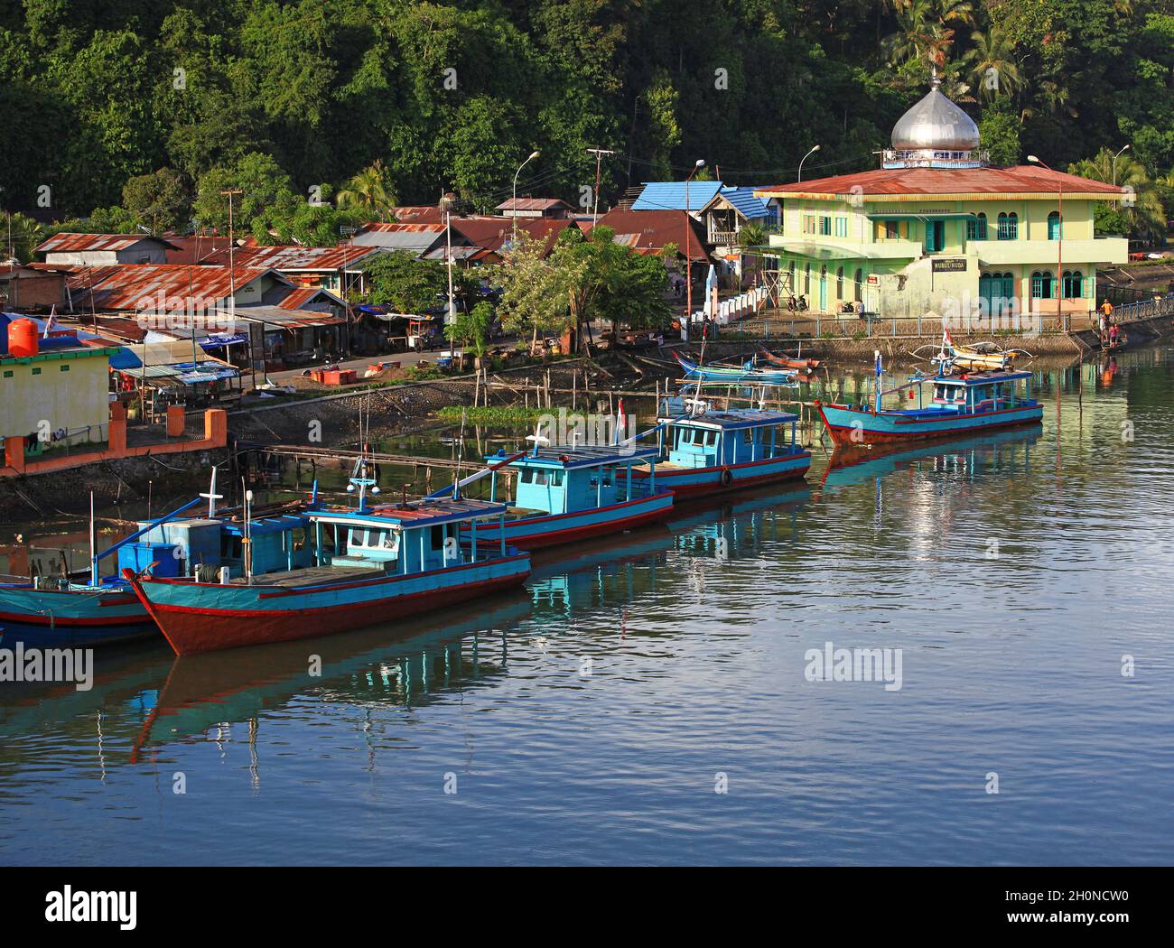 Muaro is a small old port on the Batang Arau river used by many small wooden fishing boats in the old town part of Padang, West Sumatra, Indonesia. Stock Photo