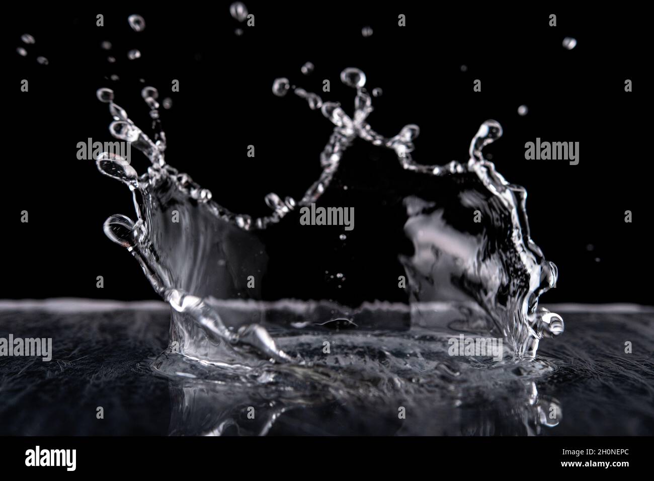 Water splash isolated on black background.  Water texture. Stock Photo
