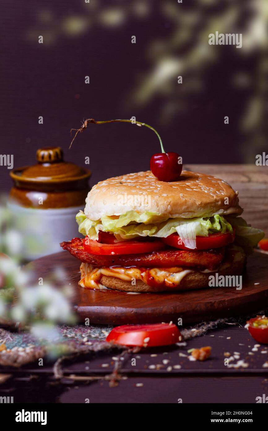 Juicy chicken grill burger, hamburger or cheeseburger with one chicken with sauce. Concept of American fast food. space Stock - Alamy