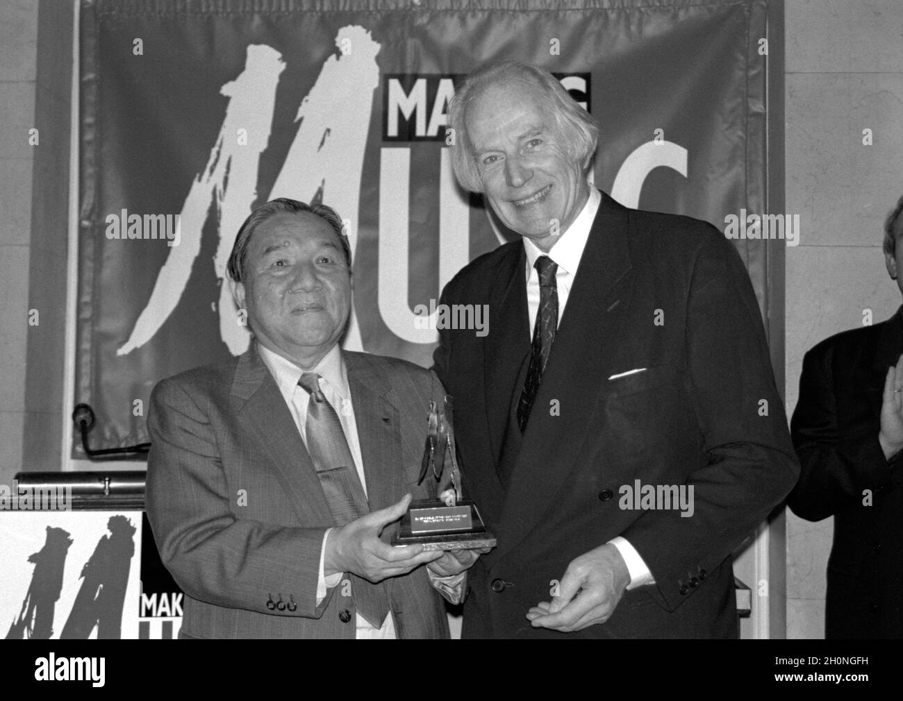 English record producer Sir George Martin, CBE (right) presenting an award to Ikutaro Kakehashi, founder of the Roland Corporation, at the Frankfurt Music Fair in Germany in 1994. Stock Photo
