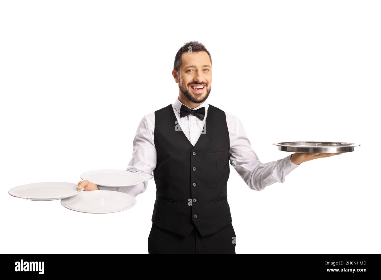 Professional waiter holding empty plates and a silver tray isolated on