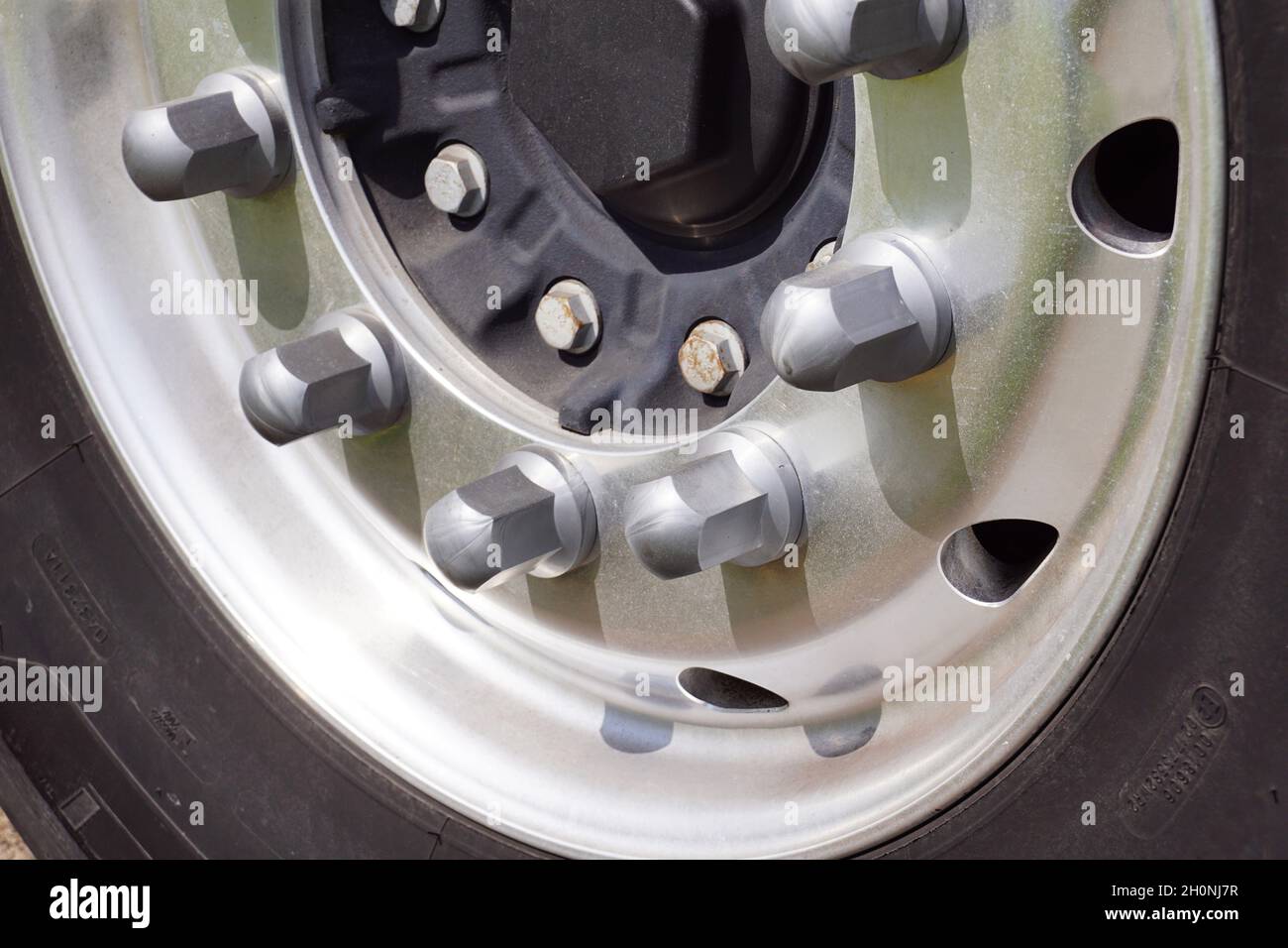 Tire, rim, bolts. Closeup of a truck wheel. Stock Photo