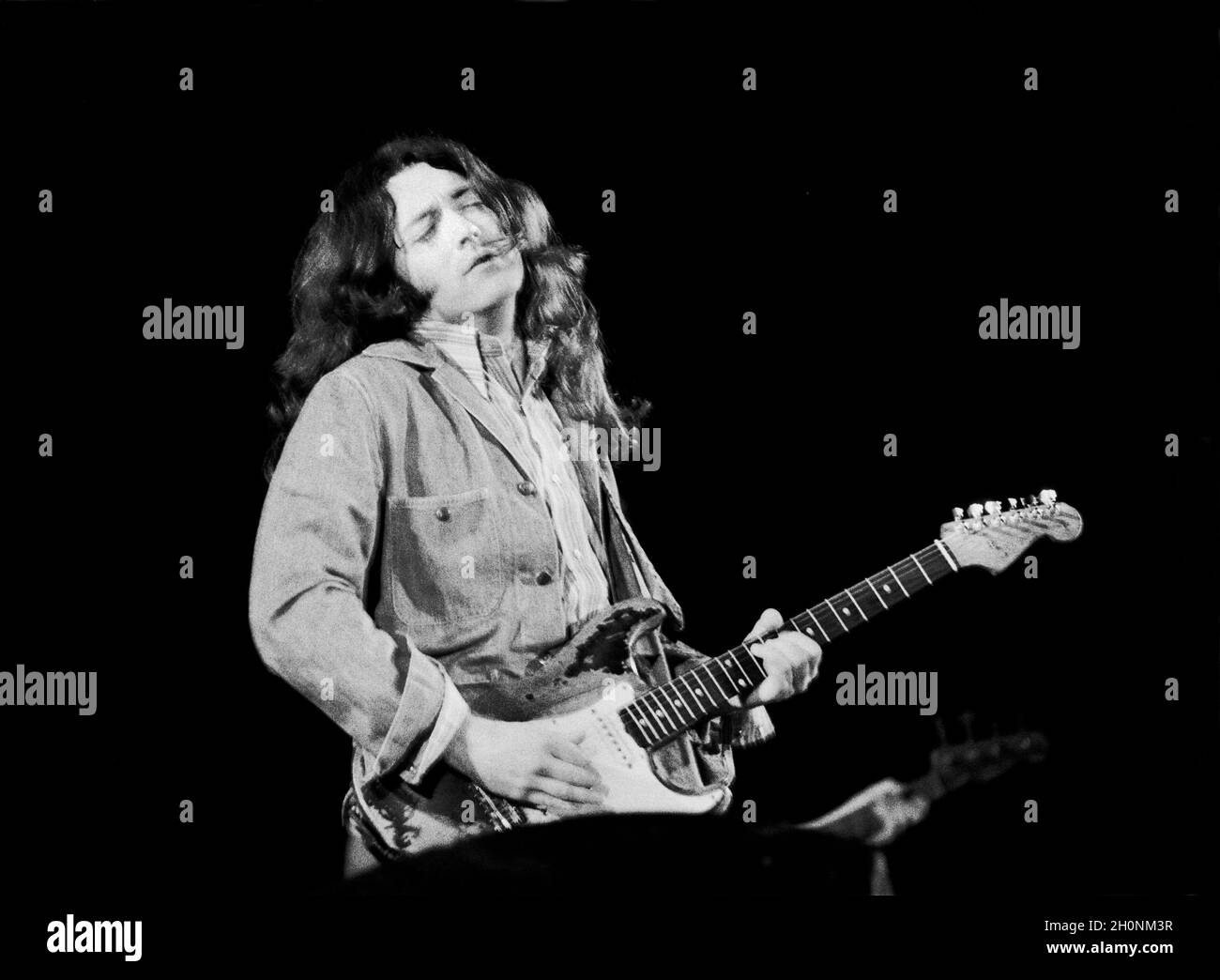 Irish blues/rock guitarist and singer Rory Gallagher at the Rainbow Theatre, London, England in October 1980. Stock Photo