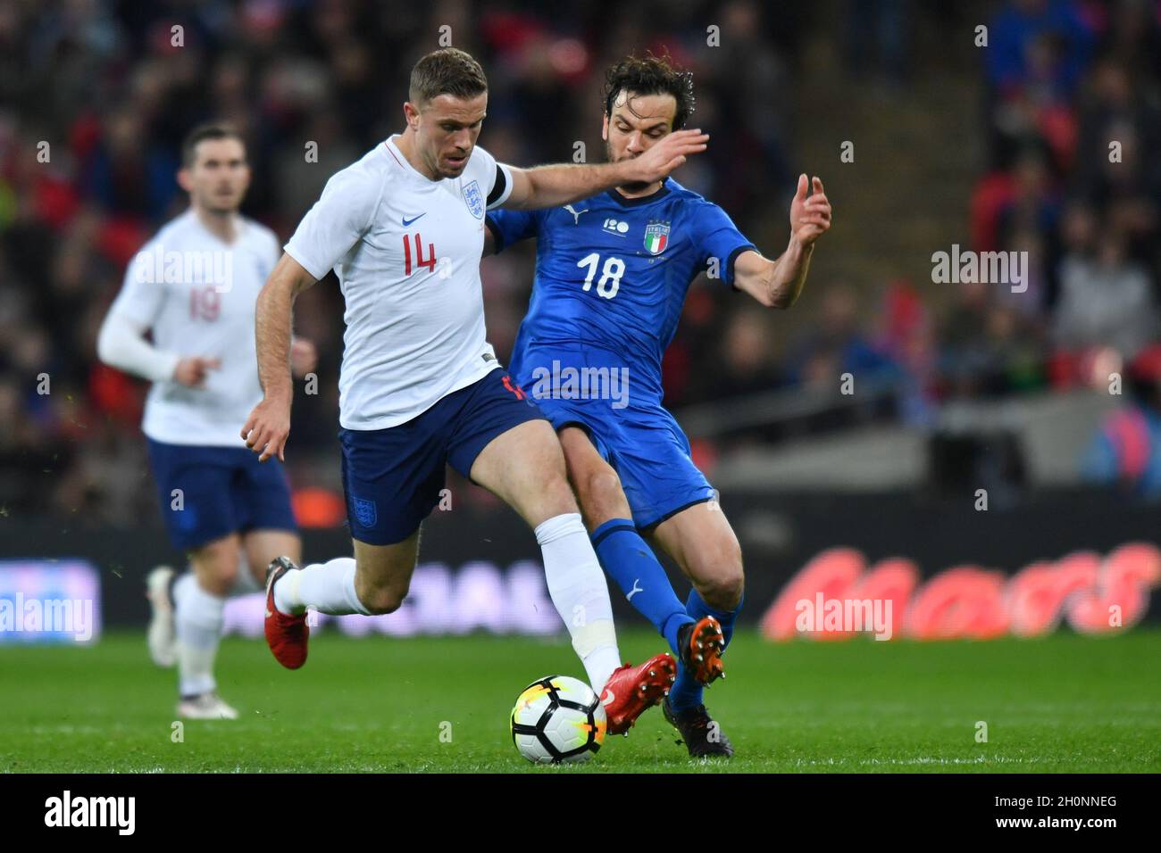 England's Jordan Henderson is tackled by Italy's Marco Parolo Stock Photo -  Alamy