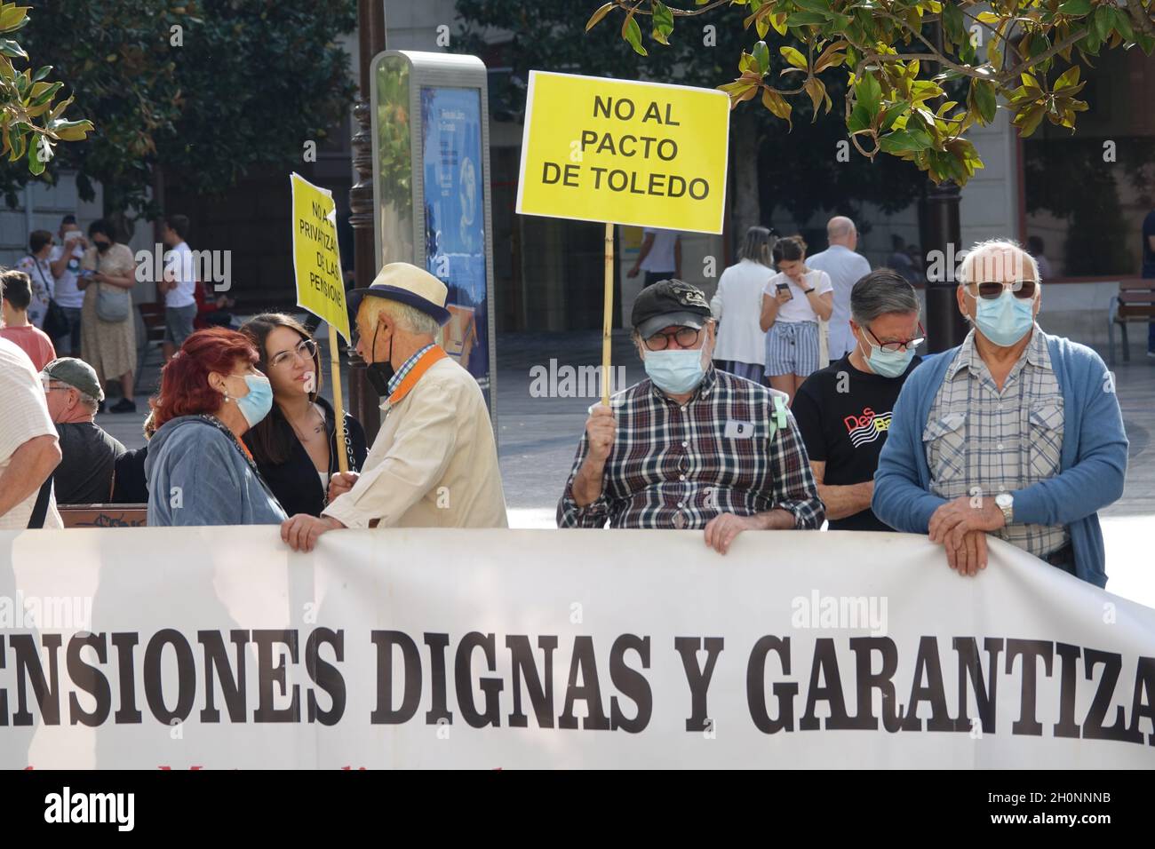 Granada, Spain; October-11, 2021: Group of elderly people demonstrating in Granada (Spain) against the government law that cuts pensions for retirees Stock Photo