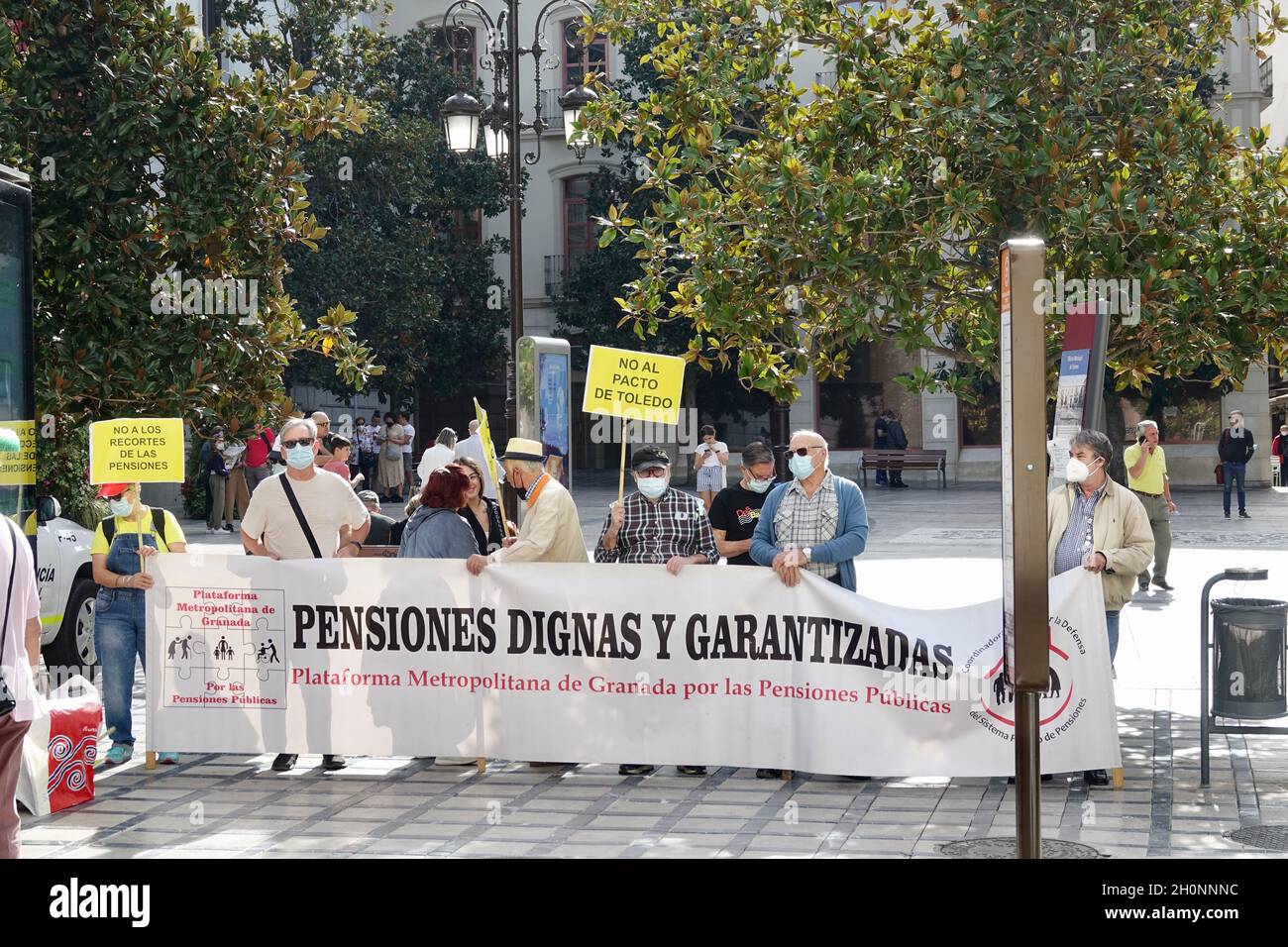 Granada, Spain; October-11, 2021: Group of elderly people demonstrating in Granada (Spain) against the government law that cuts pensions for retirees Stock Photo