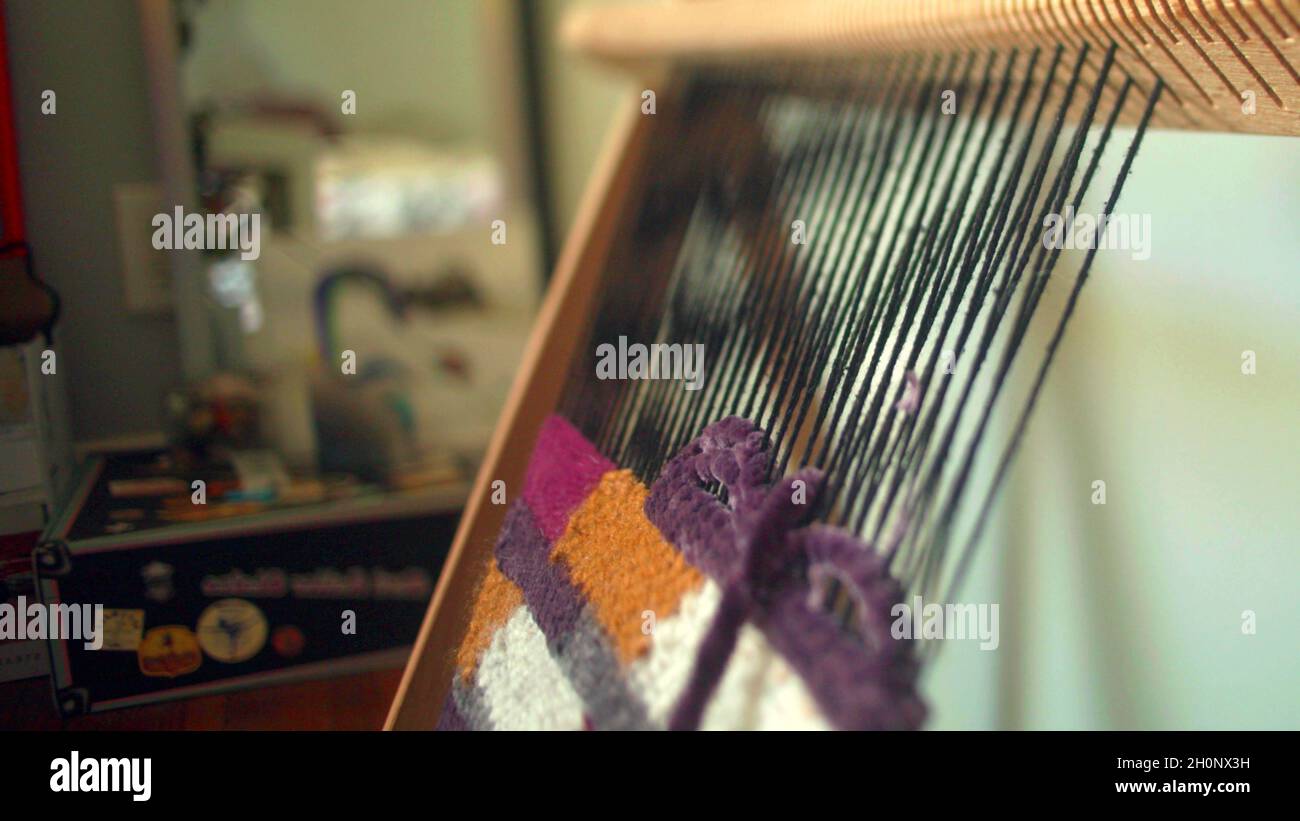 Close-up on a weaving board Stock Photo