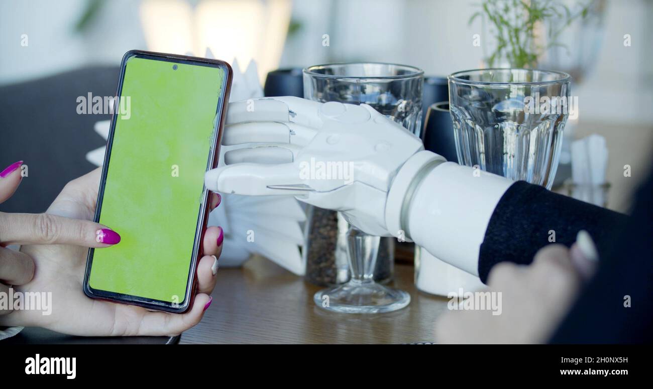 Photo of a phone and hand prosthesis Stock Photo