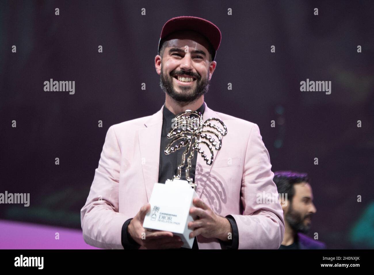 Canadian filmmaker Eric Piccoli lifts the Award of the Dior Revelation Prize in Je voudrais qu on m efface (I would like to be erased) delivered to Canadian actor Malik Gervais-Aubourg during the 4th edition of the Cannes International Series Festival (Canneseries) in Cannes, on October 13, 2021, France. Photo by David Niviere/ABACAPRESS.COM Stock Photo