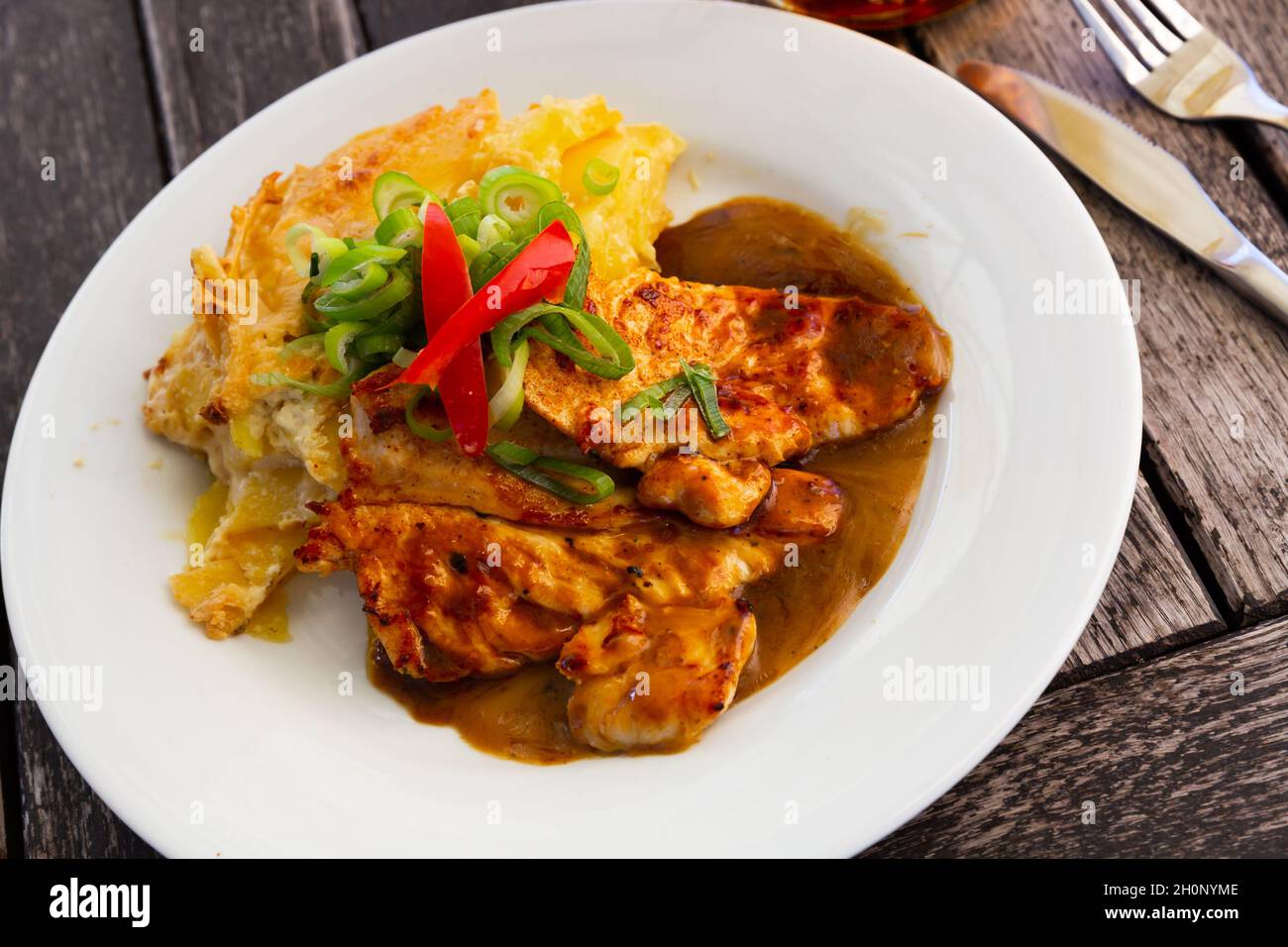Chicken with baked potato Stock Photo - Alamy