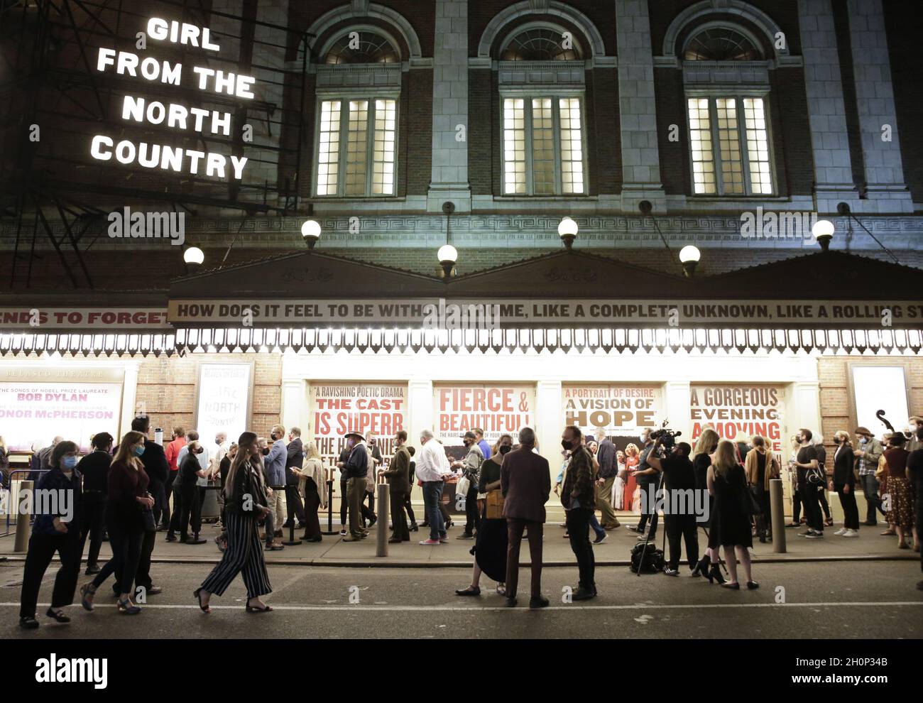 New York, United States. 13th Oct, 2021. Theater goers wait to enter The Belasco Theatre for the Broadway re-opening night of 'Girl From The North Country' in New York City on Wednesday, October 13, 2021. Girl From The North Country, featuring the music of the legendary Bob Dylan reimagined by celebrated playwright Conor McPherson, was the last show to open on Broadway prior to the COVID shutdown in 2020. Photo by John Angelillo/UPI Credit: UPI/Alamy Live News Stock Photo