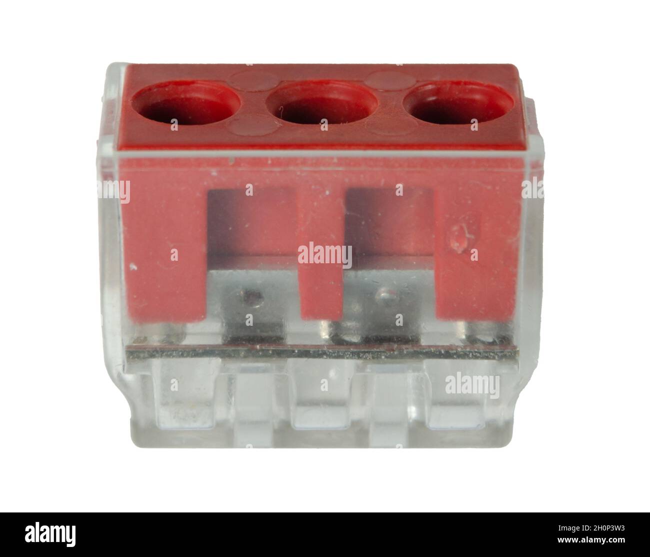 Standard terminal block 3 red contacts in transparent plastic housing on a white background Stock Photo