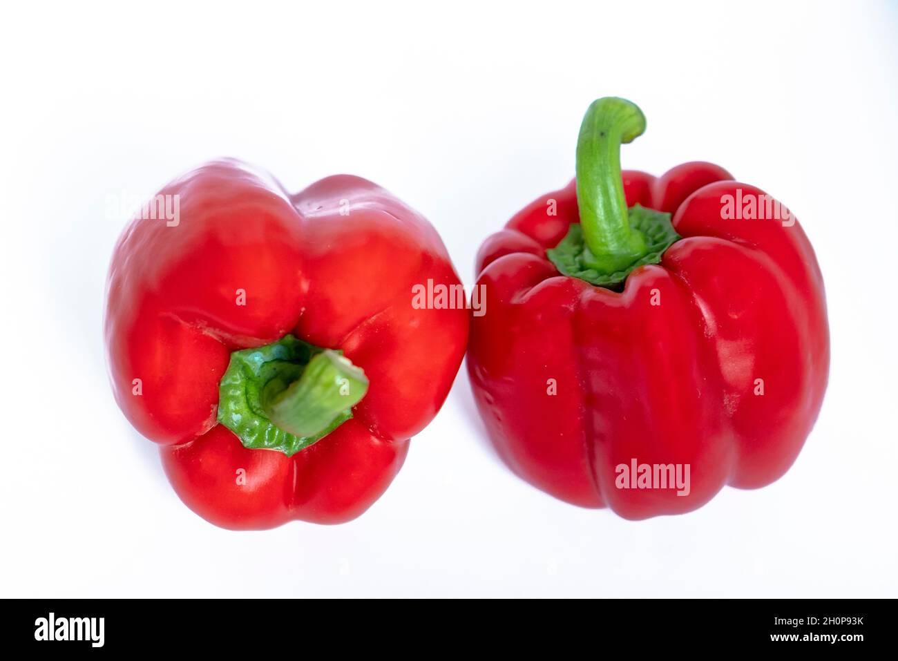 Red bell peppers isolated on white background. Fruits rich in vitamins