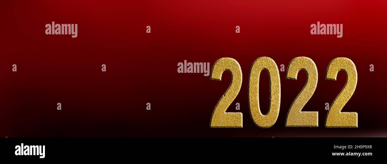 golden 2022 number on red background with copy space Stock Photo