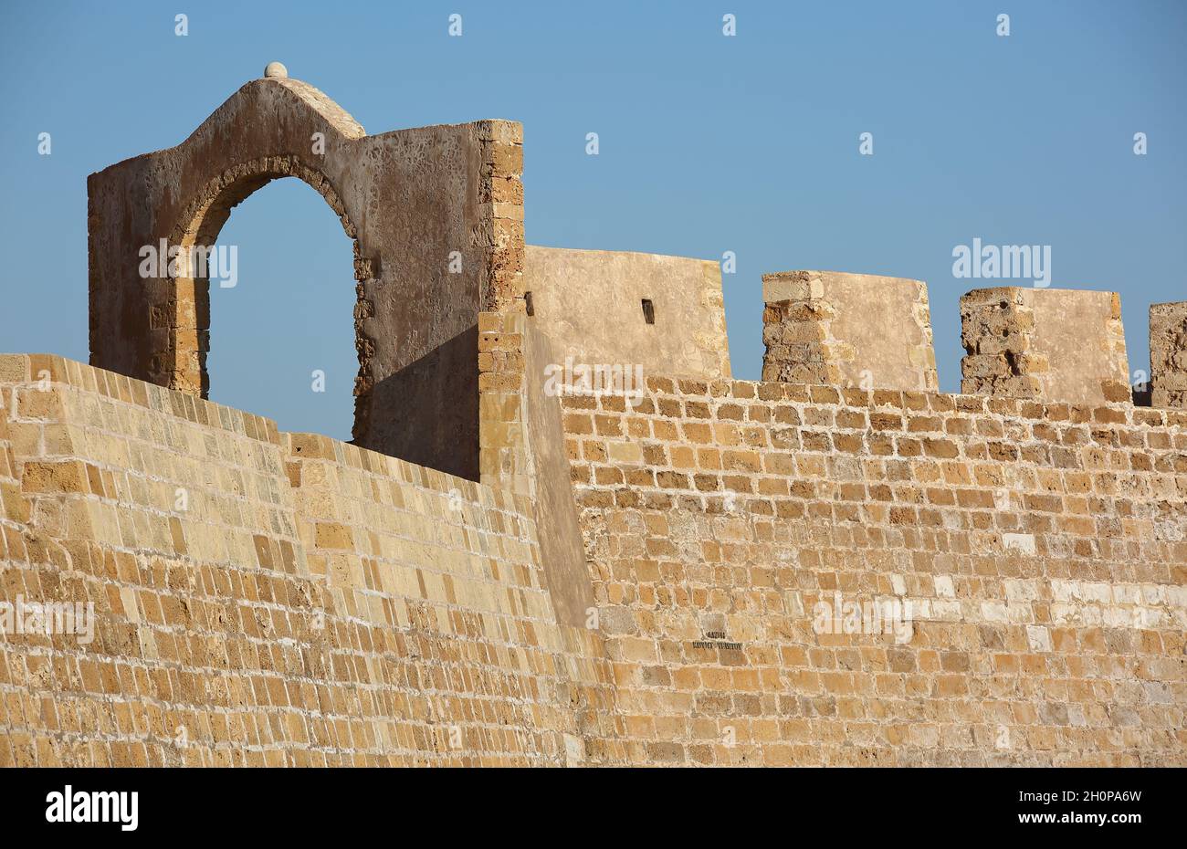 Wall of Firka Venetian Fortress in Chania, Crete, arch and architectural details, against clear blue sky Stock Photo