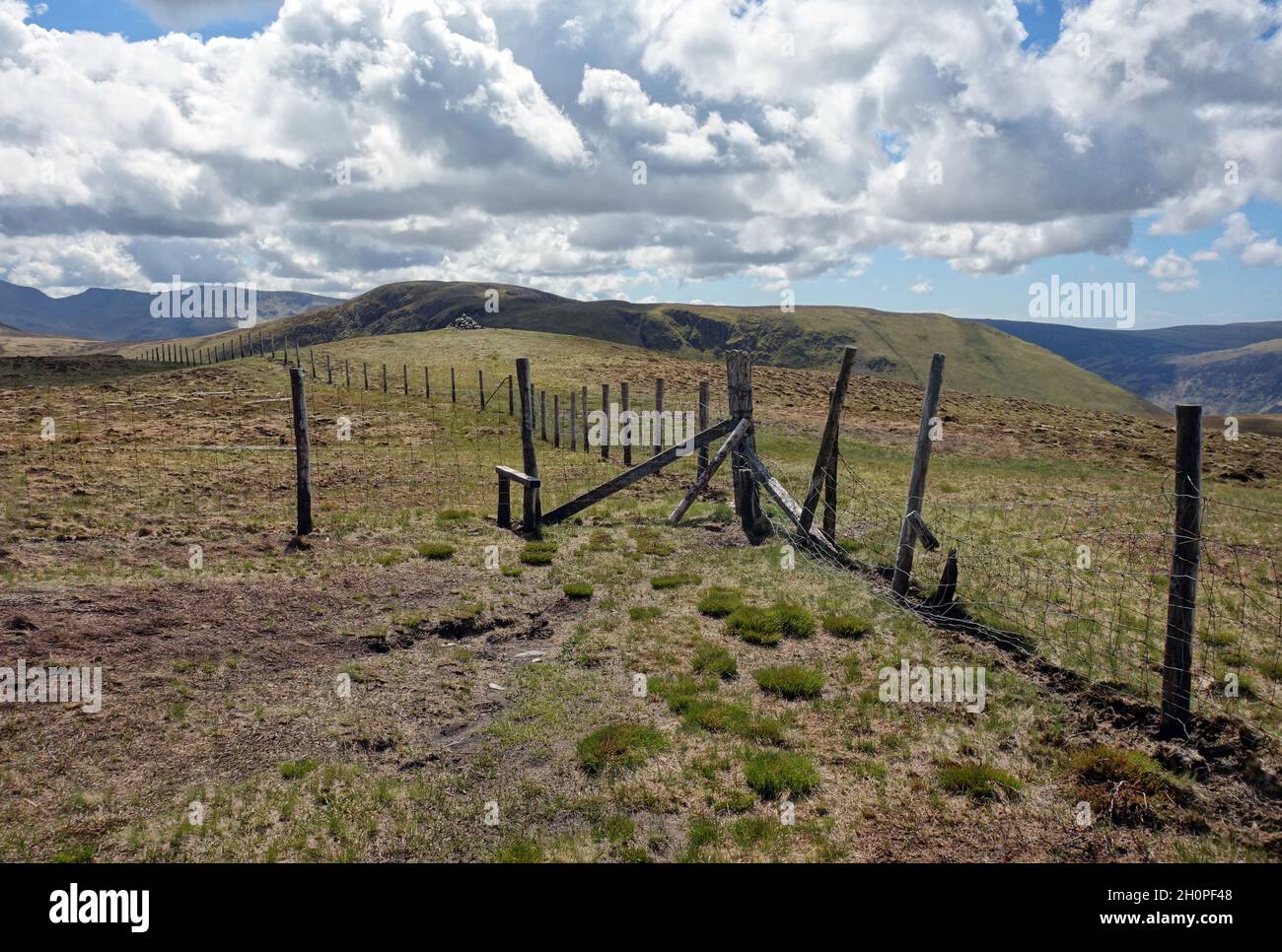 The Wire Fence & Wooden Stile on the Summit of the Wainwright in the 'Gavel Fell' in the Lake