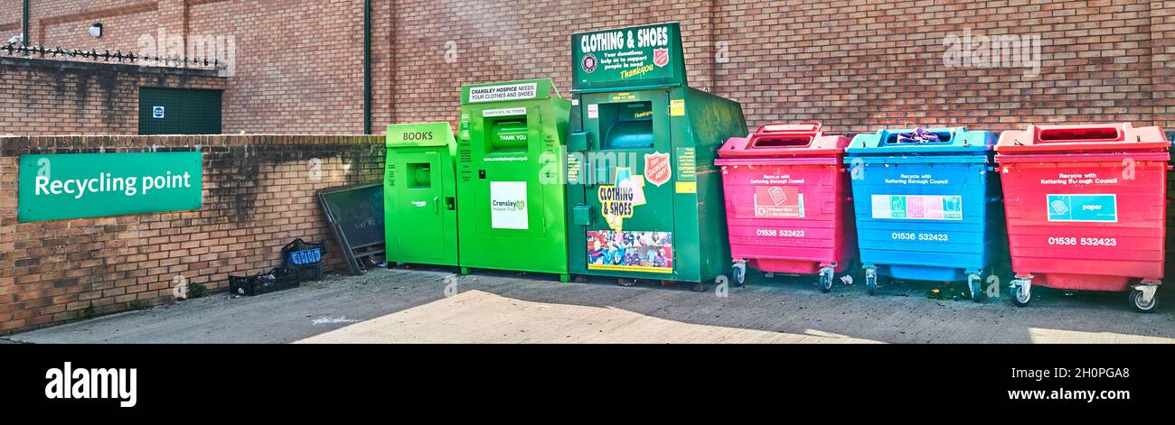 Recycling point, with bins for sorting rubbish and unwanted goods, outside Morrisons store, Kettering, England. Stock Photo