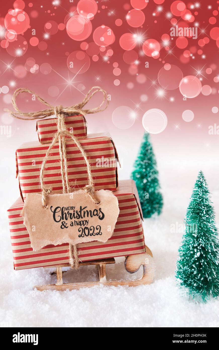 Present Christmas 2022 Sled, Snow, Present, Merry Christmas And A Happy 2022, Red Background Stock  Photo - Alamy