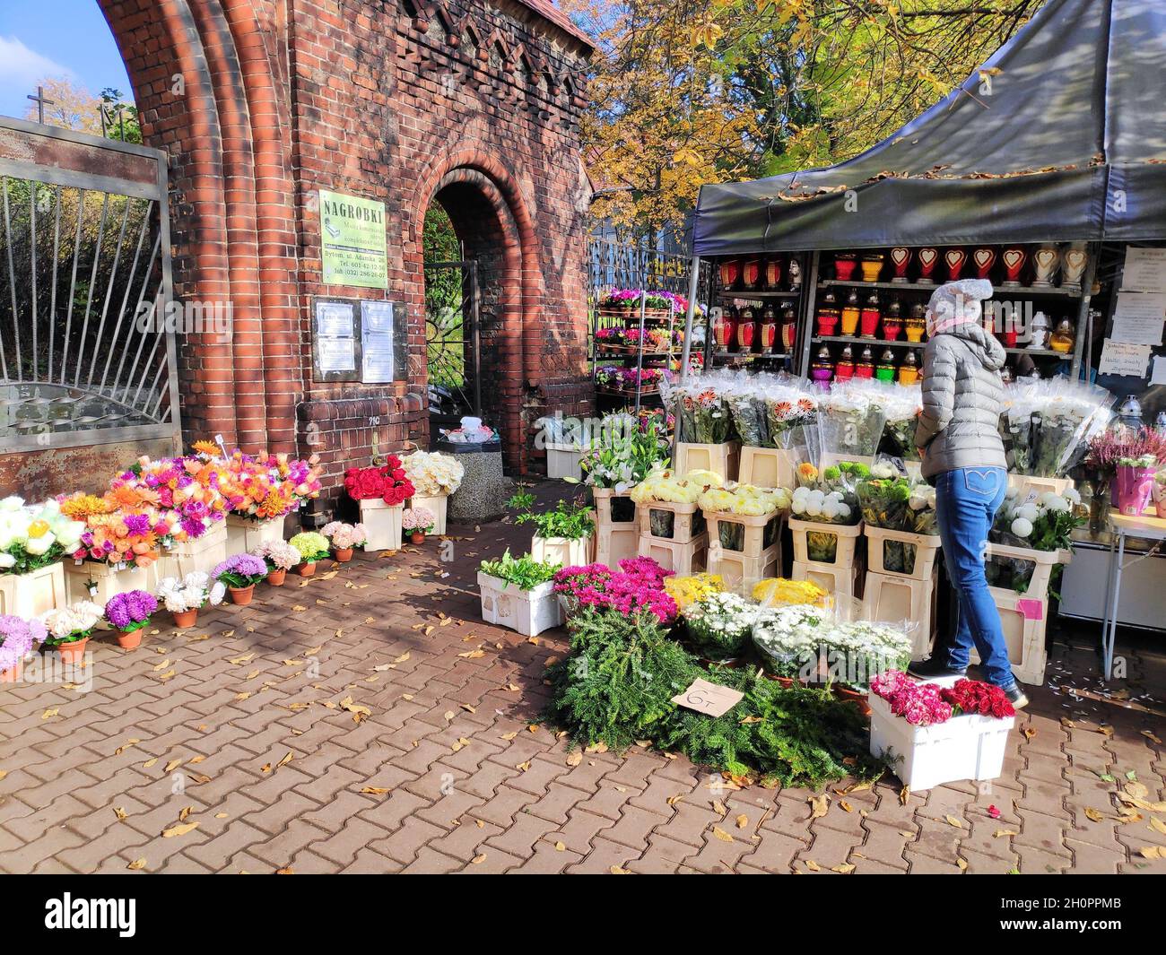 BYTOM, POLAND - OCTOBER 25, 2020: Cemetery candle and artificial flower shop before All Saints Day in Bytom. All Saints Day celebration at cemeteries Stock Photo