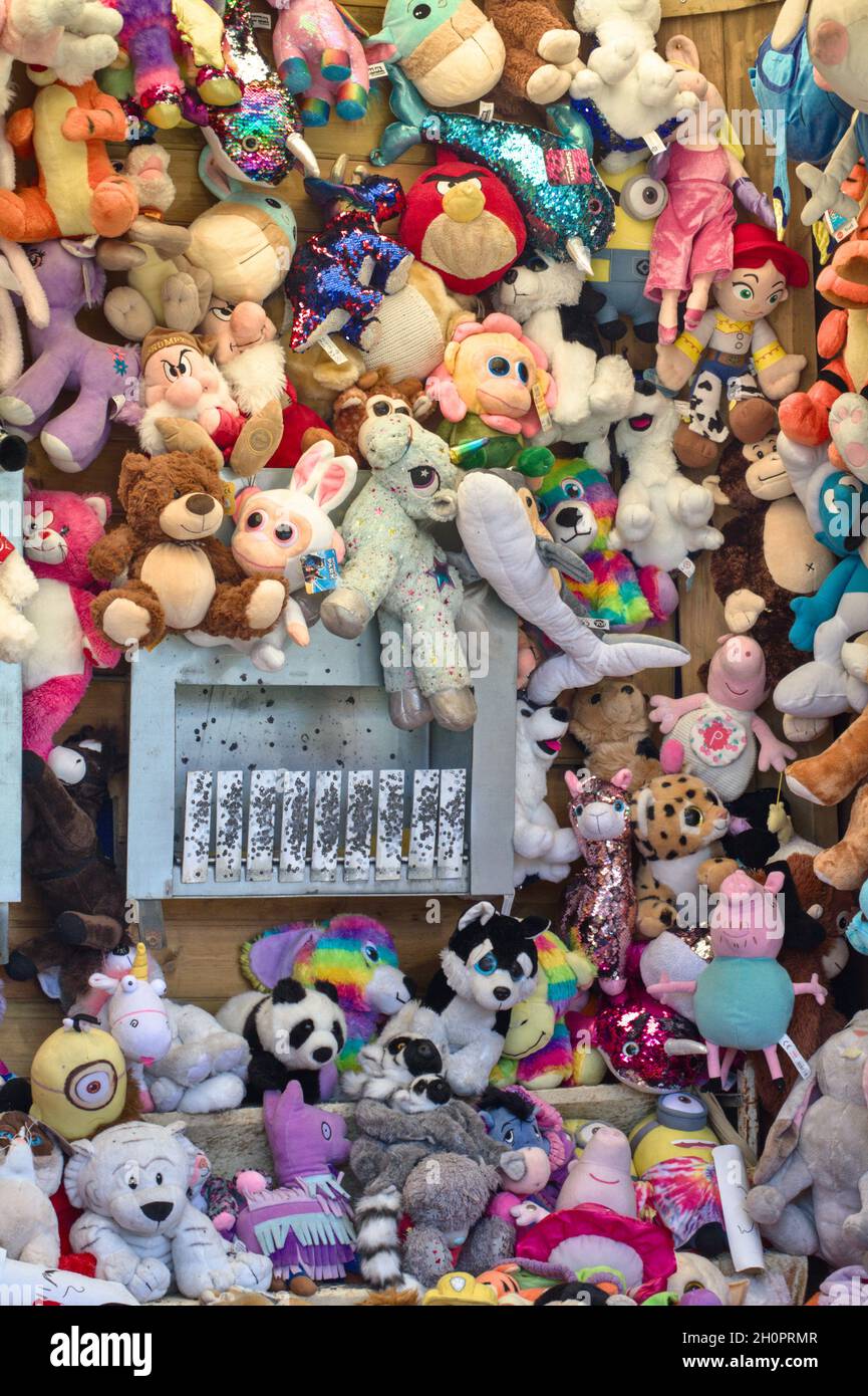 Shooting Gallery Stall With Gun And Targets Set Amongst Lots Of Fluffy Toy Prizes, Funfair UK Stock Photo