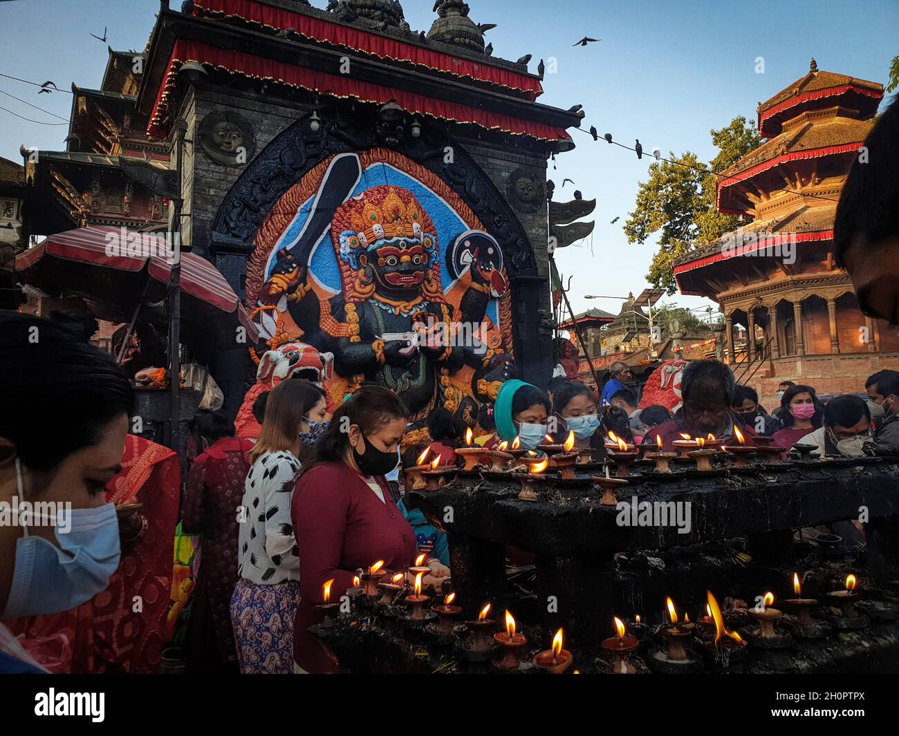 Kathmandu, Bagmati, Nepal. 14th Oct, 2021. Nepali people offer prayers in  front of Kal Bhairav on Mahanawami, the ninth day of Dashain festival in  Kathmandu, Nepal on October 14, 2021. Hindus in