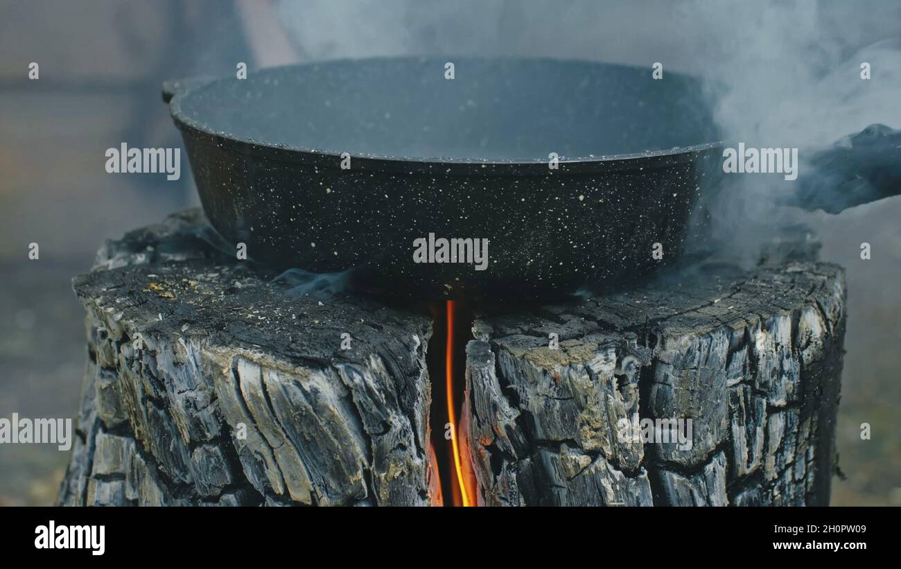 Swedish or finnish log candle. Fire burning from inside the wood Stock