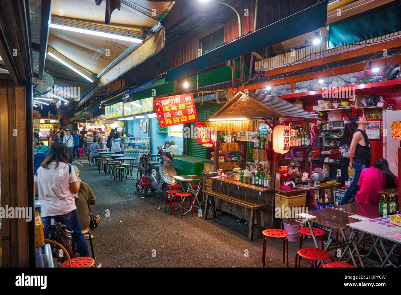 TAIPEI, TAIWAN - DECEMBER 4, 2018: People visit Raohe Night Market in Taipei. Night food markets are a big part of Taiwanese culture. Stock Photo