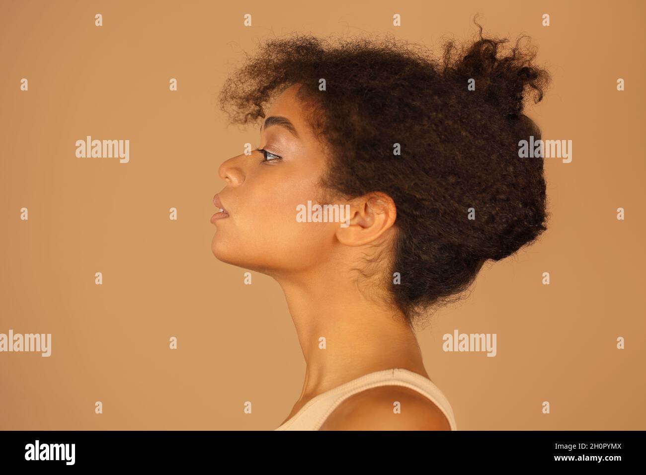 Side profile portrait of a beautiful black woman. Stock Photo