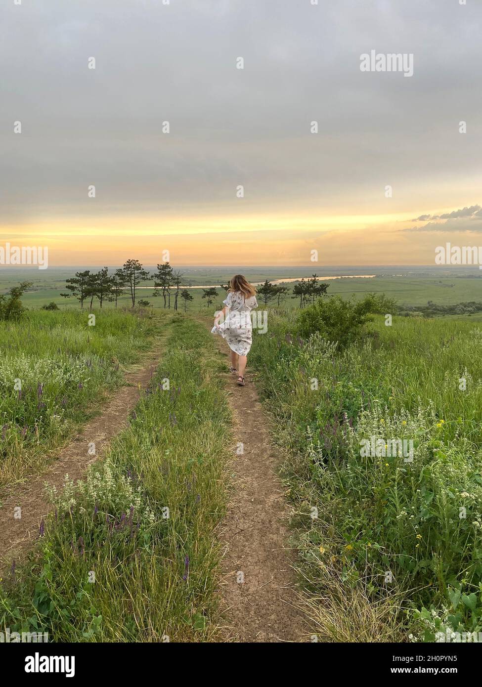Woman run rear view dress hi-res stock photography and images - Alamy