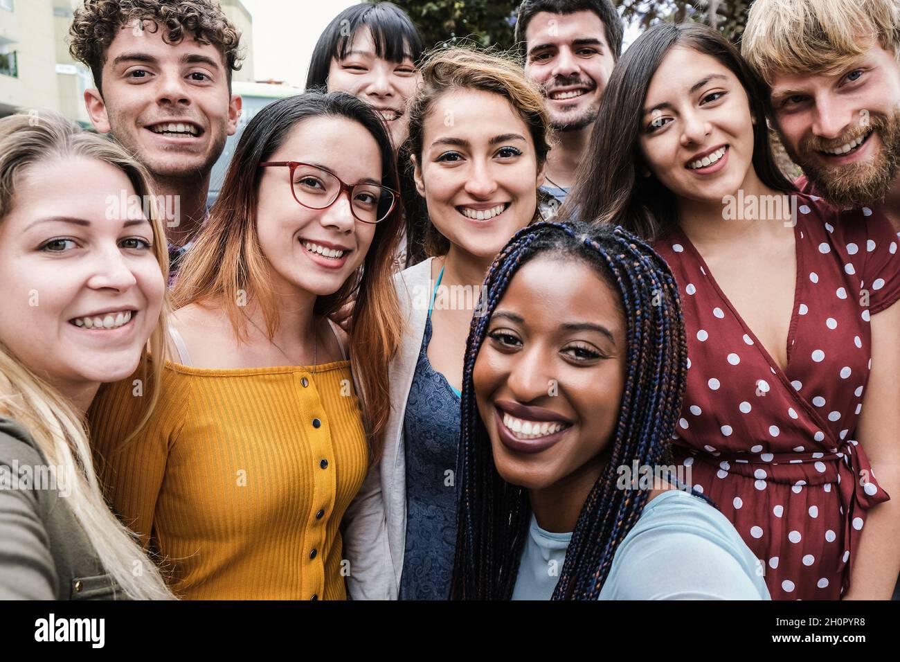 Young diverse people having fun doing selfie outdoor in the city ...