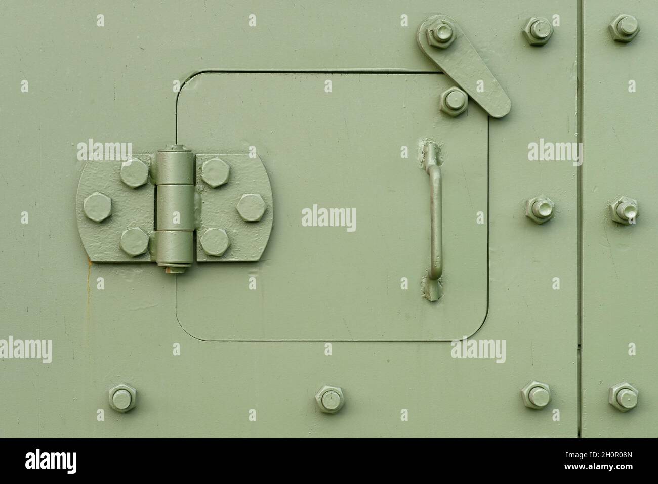 Backgrounds and textures: heavy armoured steel door, military green khaki Stock Photo