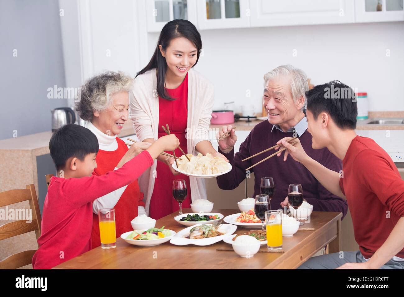 Families having a reunion dinner on New Year's Day Stock Photo