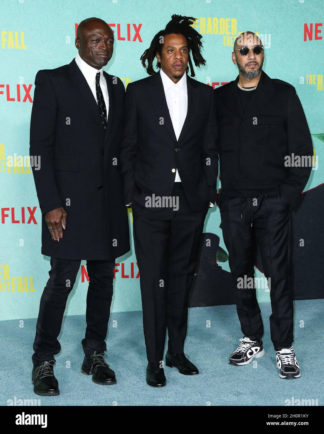 LOS ANGELES, CALIFORNIA, USA - OCTOBER 13: Singer-songwriter Seal (Henry Olusegun Adeola Samuel), rapper/producer Jay-Z (Shawn Corey Carter) and record producer Swizz Beatz (Kasseem Daoud Dean) arrive at the Los Angeles Premiere Of Netflix's 'The Harder They Fall' held at the Shrine Auditorium and Expo Hall on October 13, 2021 in Los Angeles, California, United States. (Photo by Xavier Collin/Image Press Agency) Stock Photo