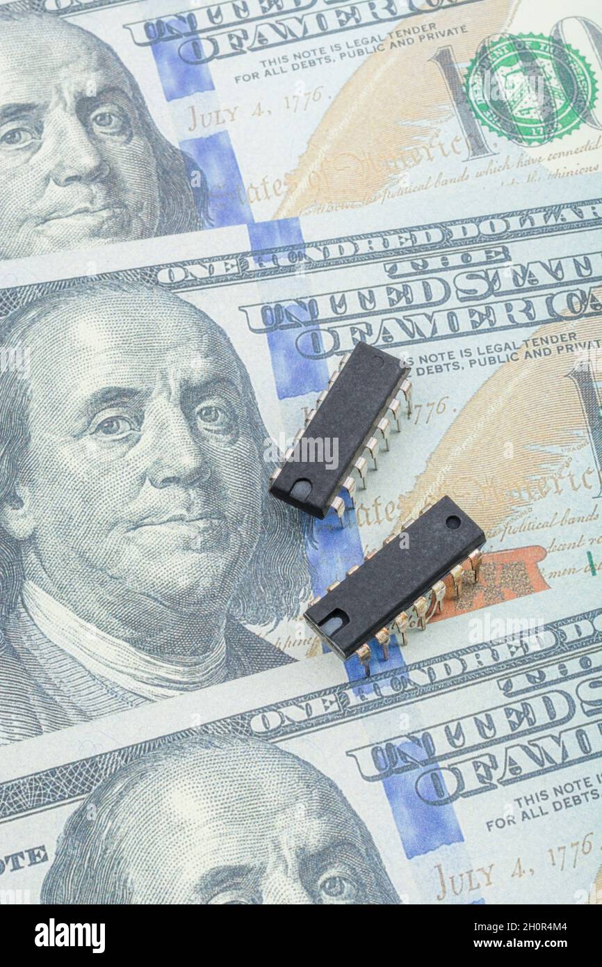 Faux 100 / Ben Franklin dollar bill with semiconductor microchip. For