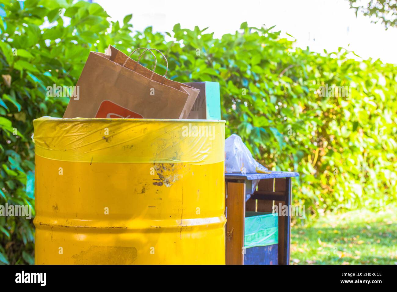 Garbage cans for collecting sorting all kinds of rubbish placed in city park Stock Photo Alamy