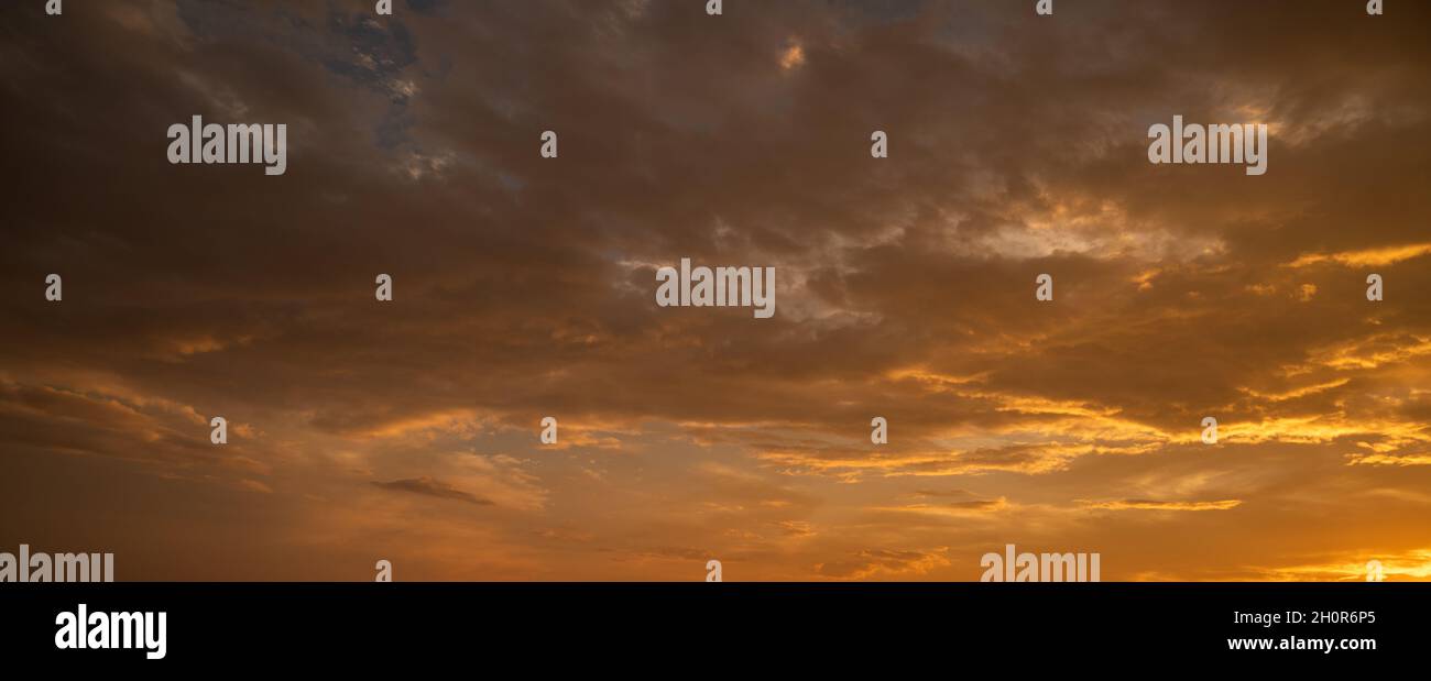 Sunset sky with orange clouds. Nature background Stock Photo - Alamy