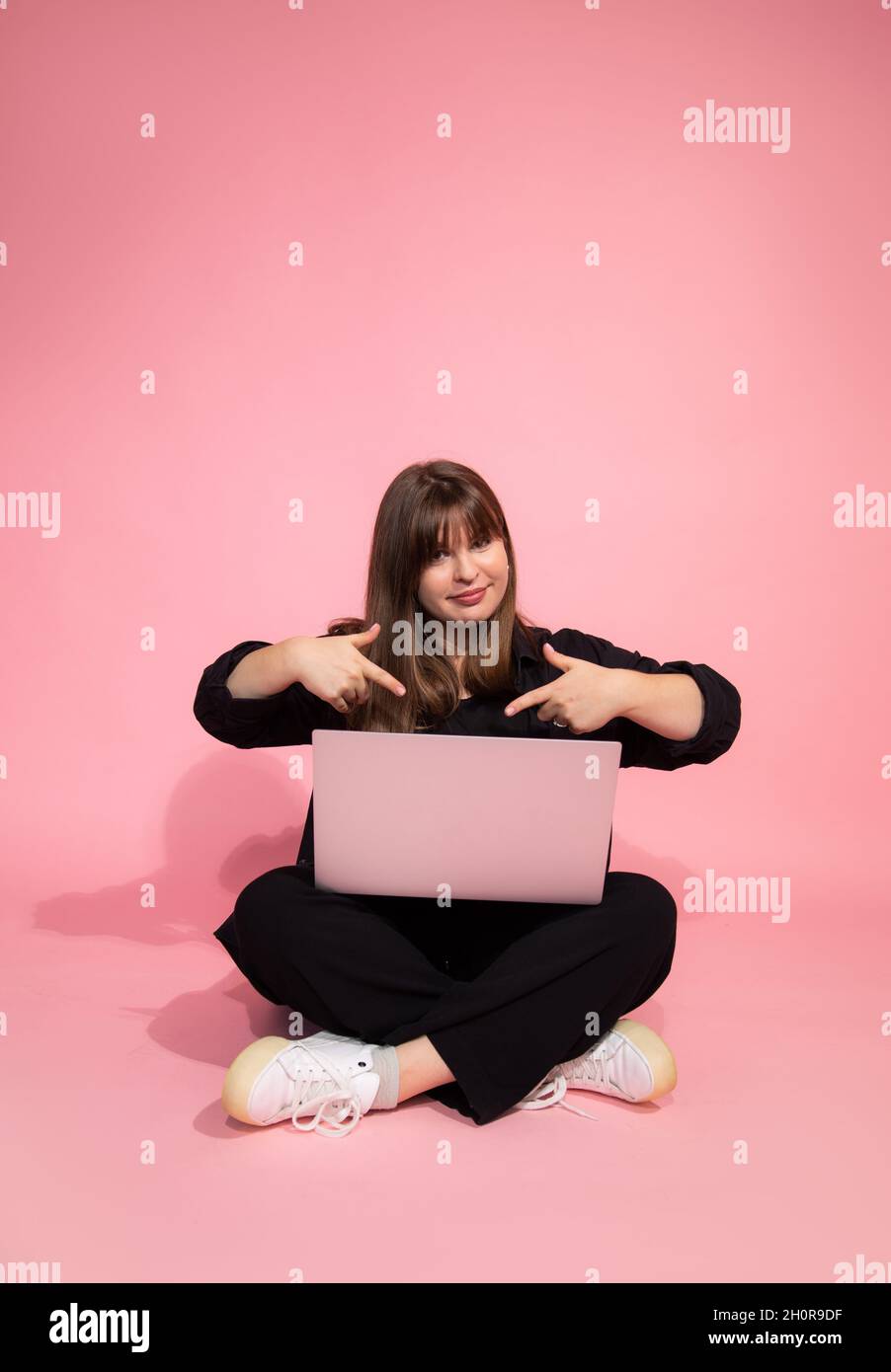 Student brown haired Girl in casual clothes Holding Laptop Computer ...