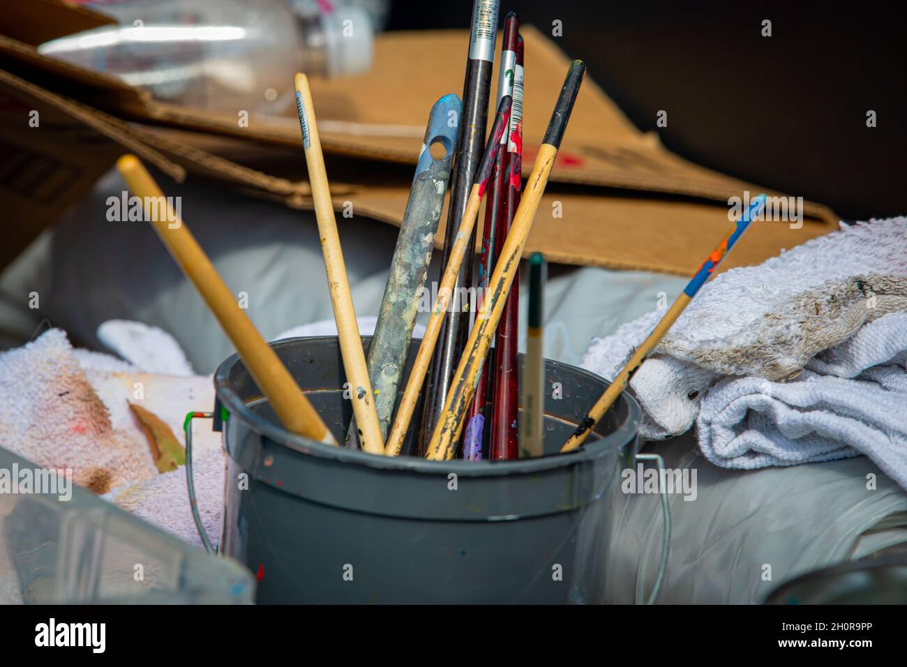Artist brushes in a container Stock Photo