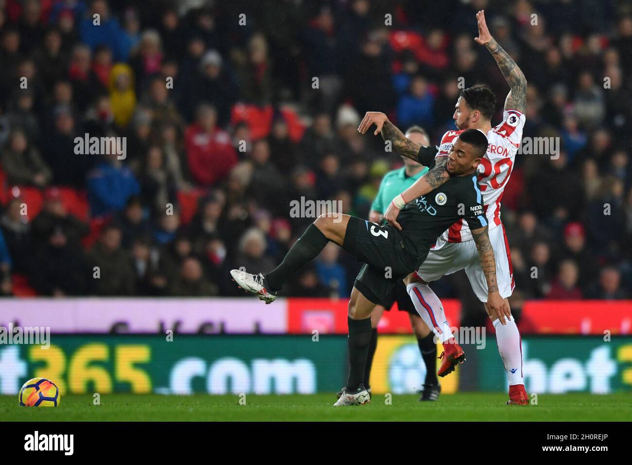 Manchester City's Gabriel Jesus is tackled by Stoke City's Geoff Cameron Stock Photo