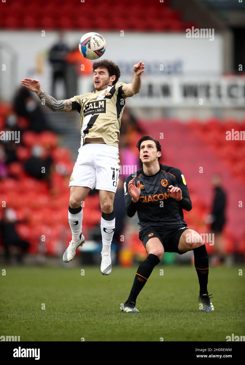File photo dated 20-02-2021 of Doncaster Rovers' Jon Taylor (left) and Hull City's Alfie Jones (right) battle for the ball. Doncaster’s Jon Taylor is set to make a long-awaited return in their League One clash with Wycombe. Issue date: Thursday October 14, 2021. Stock Photo