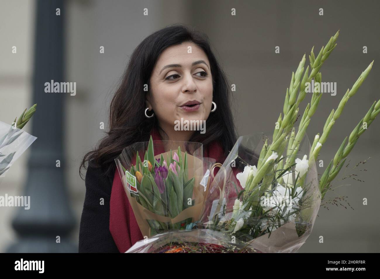 Oslo, Norway, 14/10/2021, Oslo 20211014.Minister of Labor and Social Inclusion Hadia Tajik (Labor Party) with flowers at Slottsplassen after the new government's first minister at the castle. Photo: Heiko Junge / NTB Stock Photo