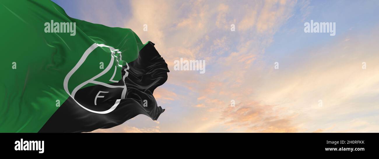 flag of Animal Liberation Front at cloudy sky background on sunset ...