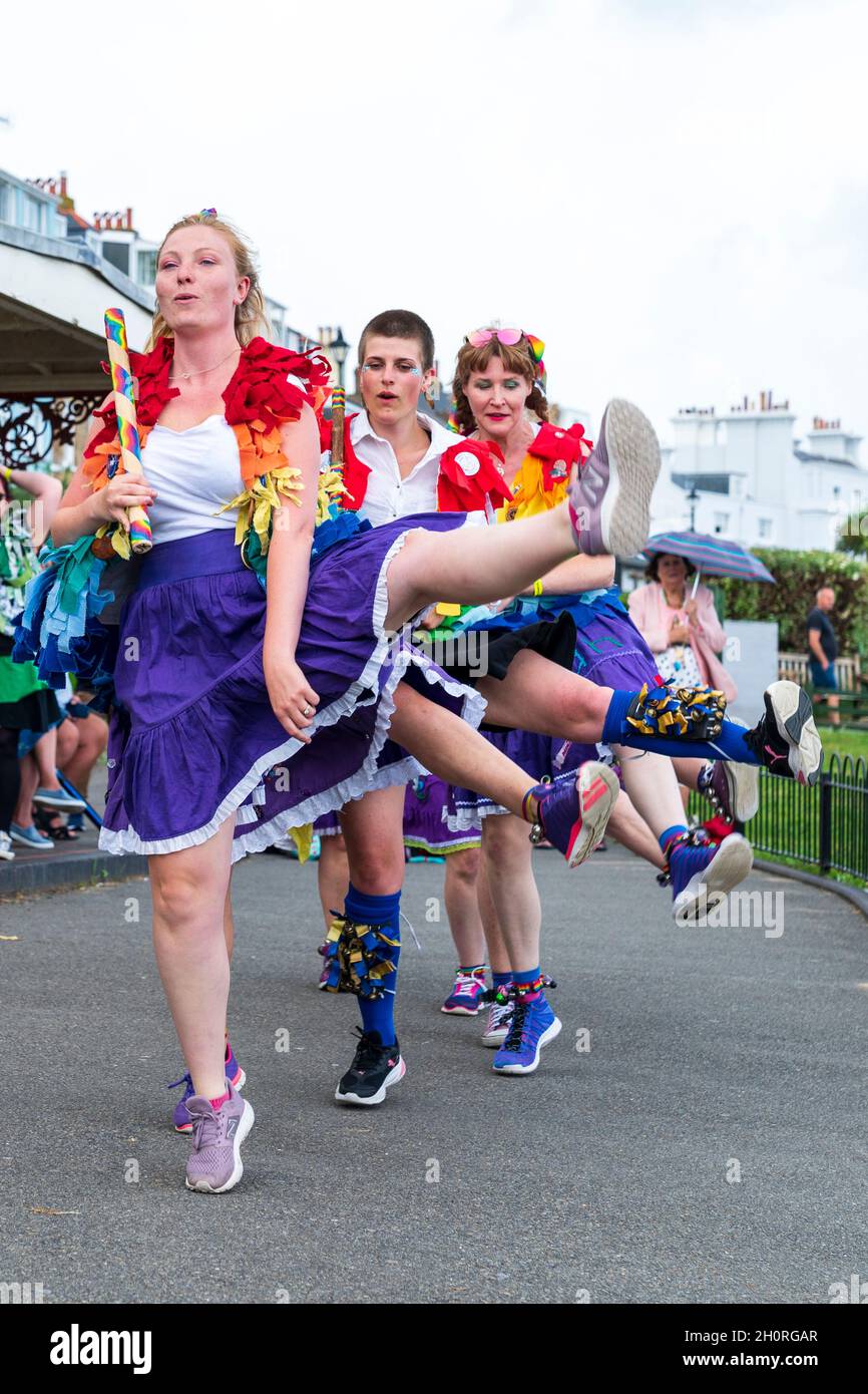 English folk dancers, the Loose Women Morris slide dancing a cancan