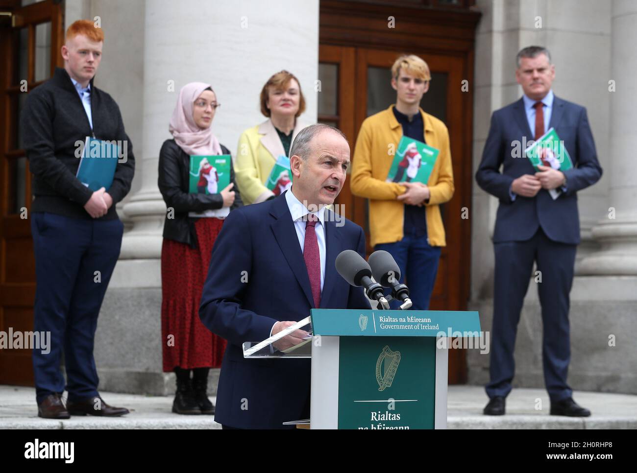 Taoiseach Micheal Martin (front) with representatives from Jigsaw (from left) Youth Advocates Jude Pierse, Karima Abbes, Chairperson Dr. Jacinta Stewart, Youth Advocate Sam Kelly, and CEO Dr. Joseph Duffy, at Government Buildings, Dublin, for the launch of Jigsaw’s Organisation Strategy 2022 – 2025. Picture date: Thursday October 14, 2021. Stock Photo