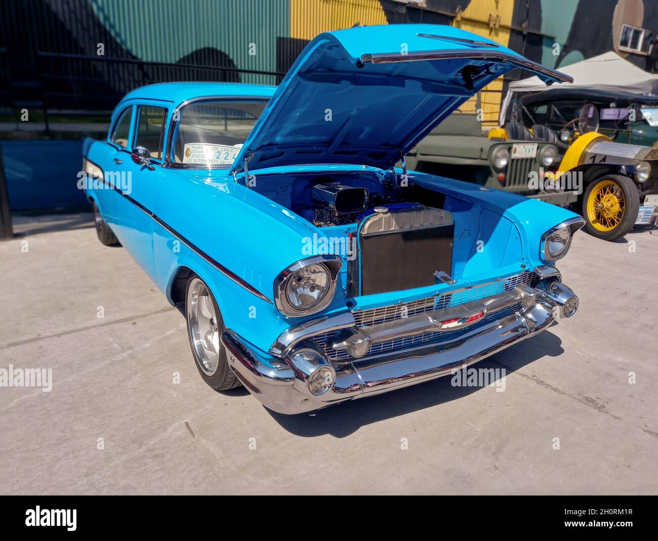 AVELLANEDA - BUENOS AIRES, ARGENTINA - Sep 27, 2021: light blue Chevrolet Bel Air 1957 two door sedan. Iconic classic car. Open hood showing engine. E Stock Photo
