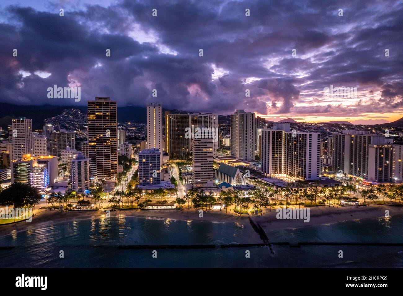 Aerial view of city and waterfront at sunrise, Waikiki Beach, Honolulu, Oahu, Hawaii, USA Stock Photo