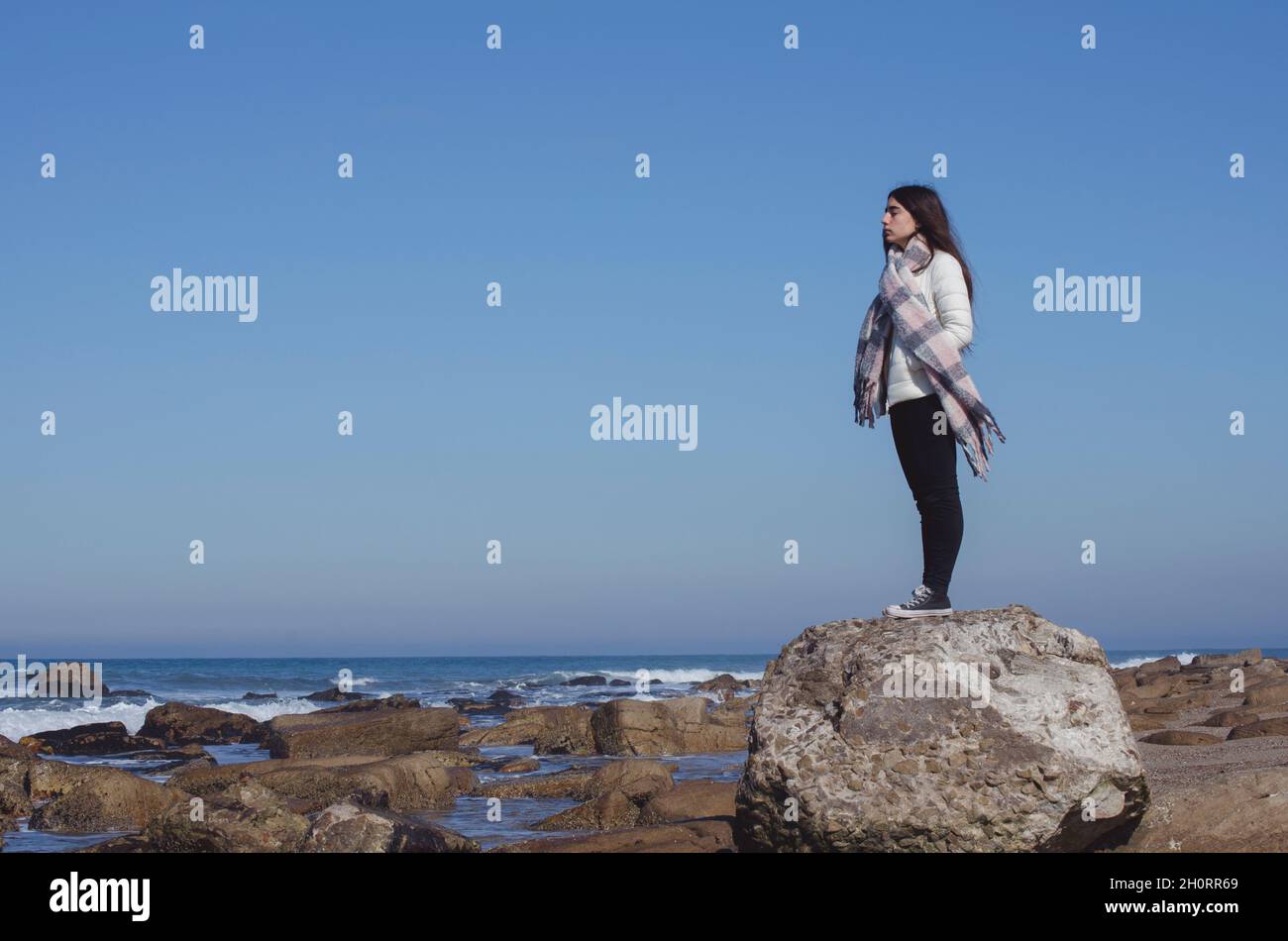 Girl Looking Over Rocks Rock looking hi-res stock photography and images - Alamy