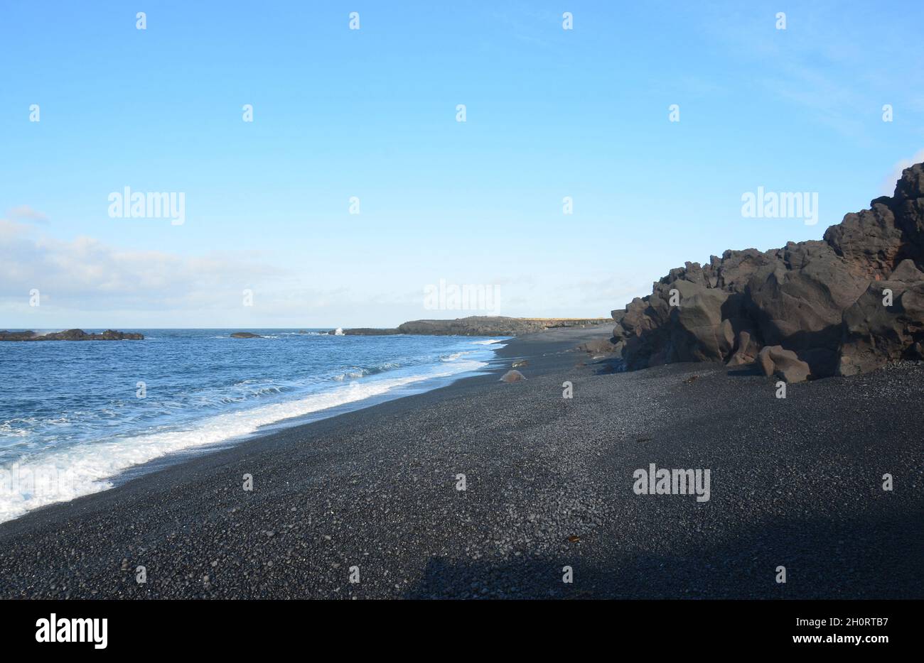 Seascape of Dritvik black sand beach in Iceland. Stock Photo